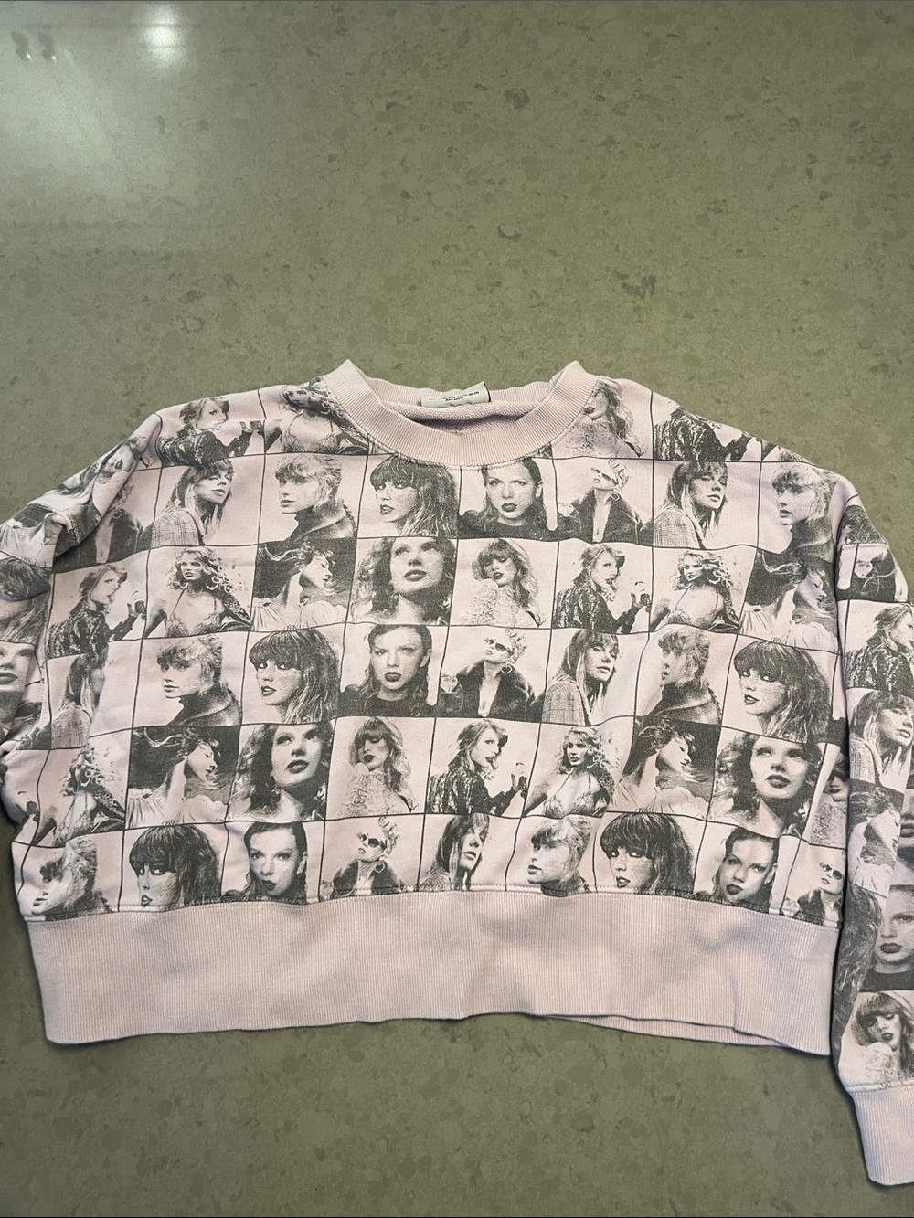 Taylor Swift sweatshirt with a batwing-style sleeve and a very boxy, cropped fit